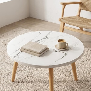 Mesa de centro redonda escandinava com acabamento em mármore branco e pés de madeira, ideal para espaços pequenos.