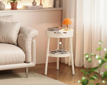 Modern circular side table in white with light wood legs for stylish living spaces
