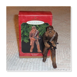 1999 Hallmark Handcrafted Star Wars Chewbacca with Bow Caster Boxed Christmas Ornament