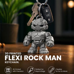 May include: A gray, 3D-printed Flexi Rock Man keychain. The keychain is attached to keys and a car key fob. The text on the image reads "3D PRINTED FLEXI ROCK MAN KEYCHAIN."