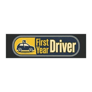 May include: A rectangular sticker with a navy blue background and a yellow and white border. The sticker features a navy blue car with an "L" on top, and the words "First Year Driver" in yellow and white.