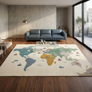 May include: A large rectangular area rug featuring a world map design on a cream background. The continents are depicted in muted shades of blue, green, yellow, and tan, accented with small illustrations of ships, whales, dolphins, and animals.
