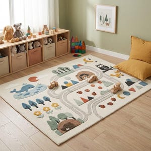 Hand tufted wool kids learning rug with woodland animals, winding play path, bear, whale, fox, owl, mountains, trees and educational shapes.