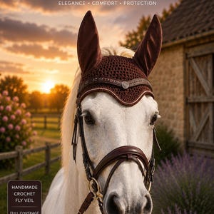 May include: A dark brown crochet fly veil with tall ear covers and a decorative browband featuring a central metal emblem. The text CROCHET FLY VEIL ELEGANCE COMFORT PROTECTION appears at the top, with HANDMADE CROCHET FLY VEIL FULL COVERAGE STYLISH DESIGN below.