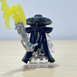 May include: A set of three ceramic mugs with a speckled, matte finish. The mugs are in shades of cream, light gray, and dark gray. Each mug has a simple, minimalist design, perfect for coffee or tea.