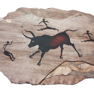 Bull Hunters cave art painting on hanging stone