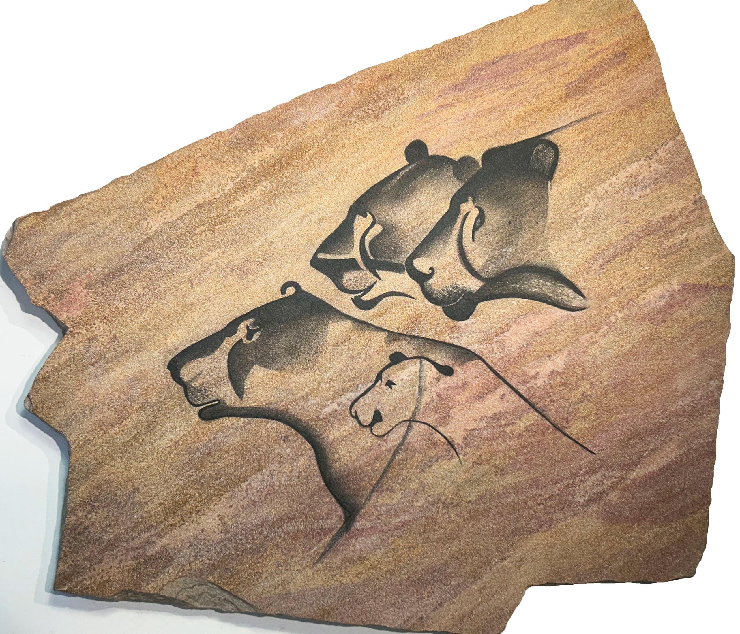Chauvet Lions cave art painting on hanging stone