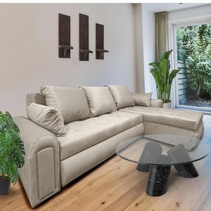 Sofá cama Aston con almacenamiento, en forma de L, con orientación izquierda o derecha, color gris.