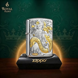 May include: A silver Zippo lighter with a detailed engraved design featuring a woman and a golden snake. The lighter is on a black stand with the Zippo logo. The Royal Flint logo is in the upper left corner.