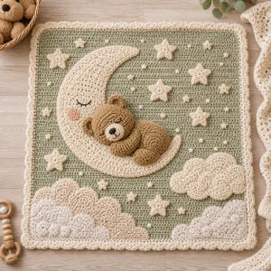 May include: A square crochet blanket in sage green featuring a cream-colored crescent moon with a sleeping face, a brown teddy bear sleeping on the moon, cream-colored clouds at the bottom, and various sizes of cream-colored stars scattered throughout.