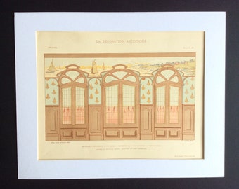 May include: A vintage illustration of a decorative design for a room with a nautical theme. The design features a series of windows with arched tops and a wallpaper pattern of sailboats. The illustration is from the publication "La Decoration Artistique" and is dated 1st year, number 50.