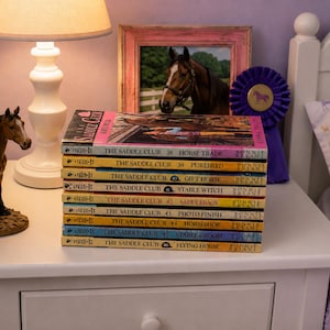 May include: A stack of nine The Saddle Club books by Bonnie Bryant, numbered 38 through 46, featuring titles such as Horse Trade, Purebred, Gift Horse, Stable Witch, Saddlebags, Photo Finish, Horseshoe, Stable Groom, and Flying Horse.
