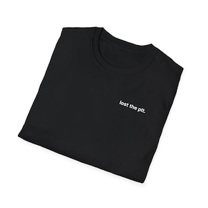 May include: A black t-shirt with a crew neck. The shirt has the phrase "lost the plt." printed in white on the front.