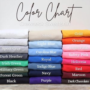 A color chart displaying various crew neck sweatshirt colors, including white, ash, sport gray, light blue, light pink, orange, dark gray, Irish green, royal blue, safety pink, helicolor, red, navy, forest green, maroon, and dark chocolate.