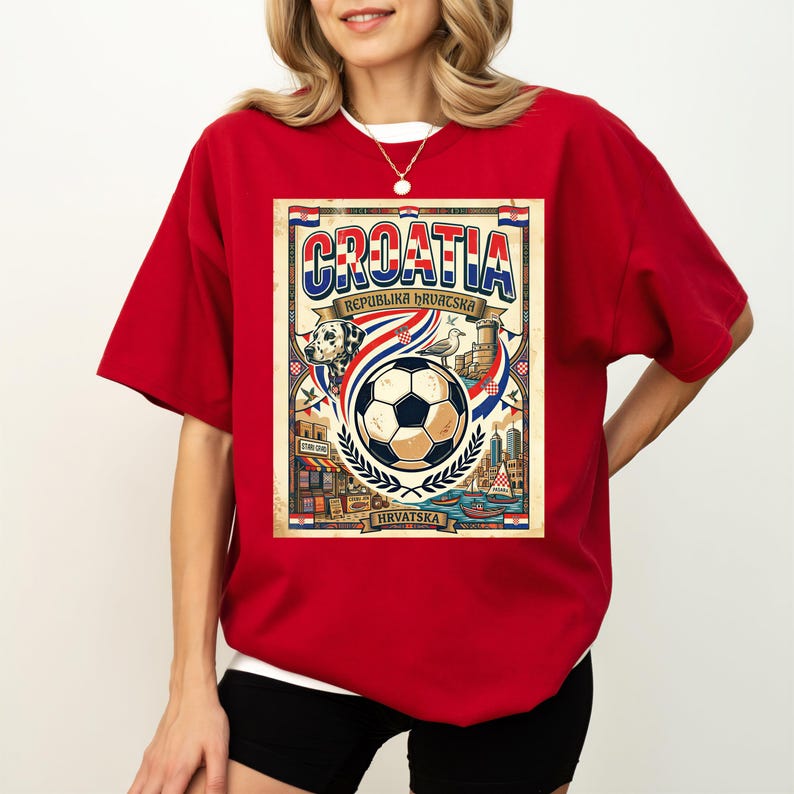 A red t-shirt with a graphic design depicting a soccer ball and various elements associated with the country of Croatia.