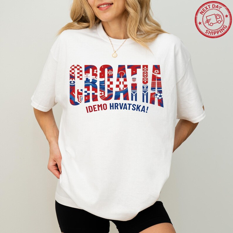 A woman wearing a white t-shirt with the word "Croatia" printed on it in a stylized manner.