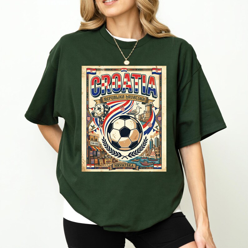 A woman wearing a green t-shirt with a graphic design featuring a soccer ball, a flag, and various landmarks, along with the text "Cratia Republika Republika" and "HRVSA".