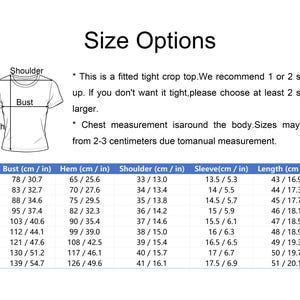 May include: A size chart for a fitted crop top featuring a line drawing of a t-shirt with labels for shoulder, bust, and length. The text advises sizing up by 1 or 2 sizes. A table lists measurements in centimetres and inches for sizes XS to 5XL.