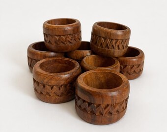 Eight Wooden Hand Carved Napkin Rings