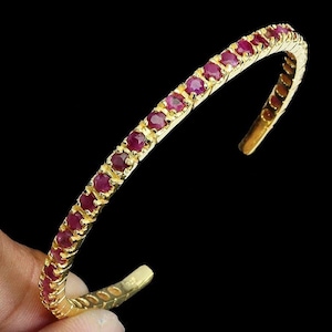 Static shape bracelet made of silver and gold with natural ruby "Ruby Sparkle"