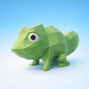 May include: A green paper chameleon figurine with a geometric, polygonal design. The chameleon has a large eye with a black pupil and white iris. The background is a gradient of light blue to white.