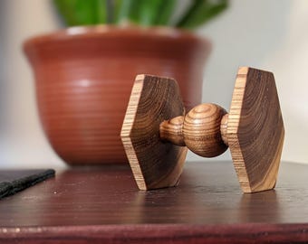 Hand-turned desk toy for movie nerd, wood tie fighter fidget model