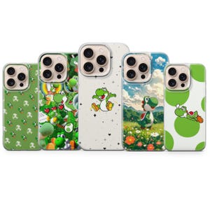 May include: Five phone cases with various designs featuring the character Yoshi. The cases are green, white, and blue, with images of Yoshi in different poses and settings. The cases have a glossy finish.