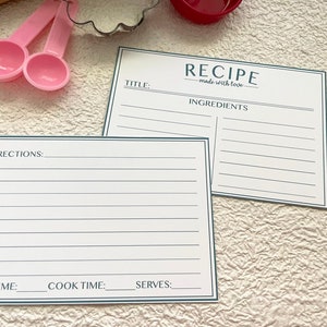 May include: Two blank recipe cards with a blue border. The top card has the text "RECIPE made with love" and "INGREDIENTS". The bottom card has the text "DIRECTIONS", "PREP TIME", "COOK TIME", and "SERVES".
