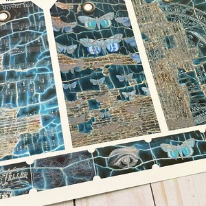 May include: Three vintage style gift tags with a blue and silver cracked paint design. The tags feature a variety of images including a crystal ball, a celestial map, and a moth. The text on the tags reads "The Crystal Ball" and "The Fortune Teller".