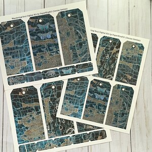 May include: A set of 10 digital printable tags with a blue and gold distressed background featuring a variety of images including butterflies, an eye, and a compass. The text "Wandering Soul Digital Kit by PaperKraftD (Denise Settles)" is printed at the top of the sheet.
