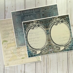 May include: Three vintage-style paper sheets with a blue and white patterned design. The top sheet has a faded blue and white pattern. The middle sheet has a blue and white pattern with a musical score and a circular frame. The bottom sheet has a faded blue and white pattern with a musical score.