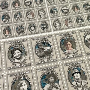 May include: A sheet of vintage-style postage stamps featuring various portraits of people. Each stamp has a blue and white mosaic background and the text "U.S. POSTAGE" and "2 CENTS".