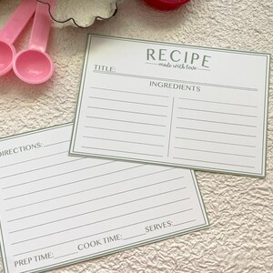 May include: Two blank recipe cards with green borders. The top card has the title "RECIPE - made with love" and the heading "INGREDIENTS". The bottom card has the headings "DIRECTIONS", "PREP TIME", "COOK TIME", and "SERVES".
