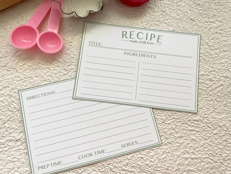 May include: Two blank recipe cards with green borders. The top card has the title "RECIPE - made with love" and the heading "INGREDIENTS". The bottom card has the headings "DIRECTIONS", "PREP TIME", "COOK TIME", and "SERVES".