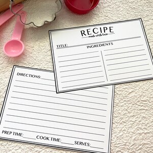 May include: Two blank recipe cards with black lines and the text "RECIPE made with love." at the top of one card. The cards have sections for title, ingredients, directions, prep time, cook time, and serves.