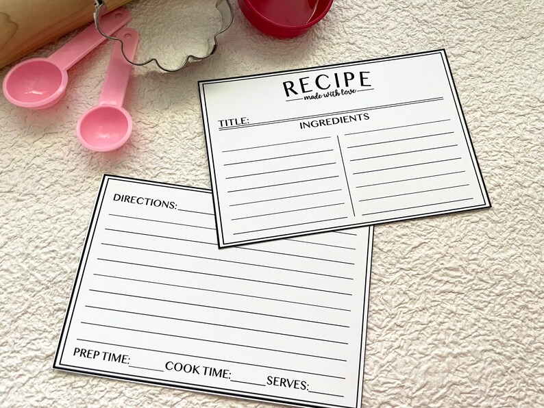 May include: Two blank recipe cards with black lines and the text "RECIPE made with love." at the top of one card. The cards have sections for title, ingredients, directions, prep time, cook time, and serves.