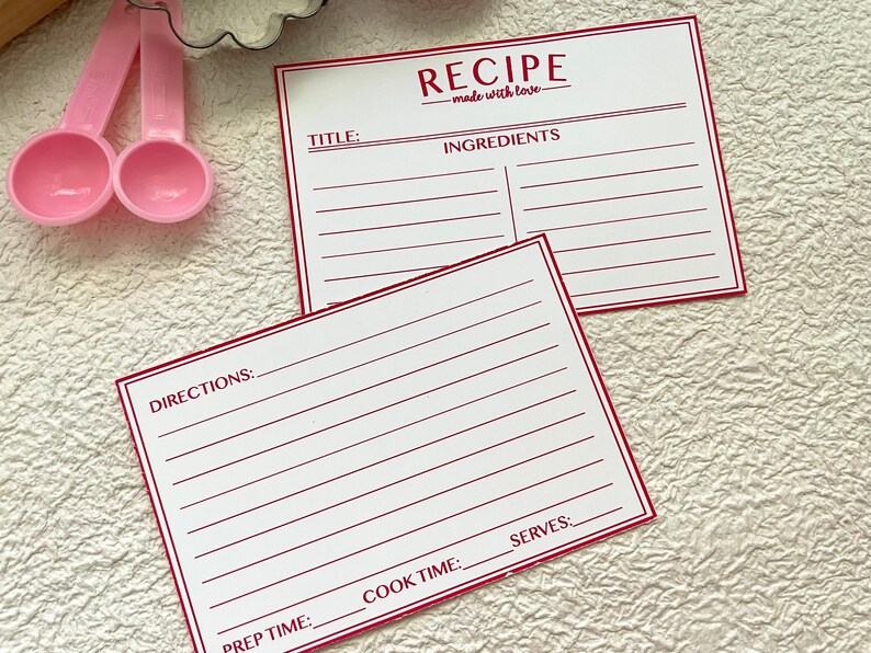 May include: Two blank recipe cards with red lines and the text "RECIPE - made with love -" at the top of the card. The cards are labeled "TITLE", "INGREDIENTS", "DIRECTIONS", "PREP TIME", "COOK TIME", and "SERVES".