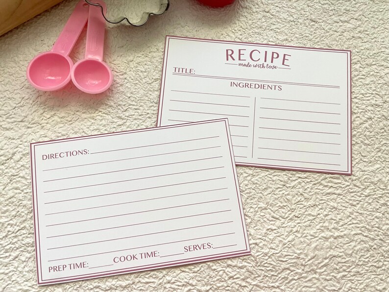 May include: Two blank recipe cards with pink lines. The top card has the title "RECIPE - made with love" and the heading "INGREDIENTS". The bottom card has the headings "DIRECTIONS", "PREP TIME", "COOK TIME", and "SERVES".