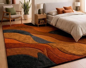 Alfombra moderna abstracta hecha a mano en tonos naranja salvia, terracota y beige, con textura suave y de alto y bajo relieve, ideal para la sala de estar.