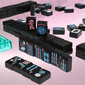 May include: A set of black Mahjong tiles featuring neon-coloured engravings in blue and pink. The tiles display various symbols, numbers, and characters, including a tile labelled JOKER. Some tiles are arranged in rows, while others are scattered.