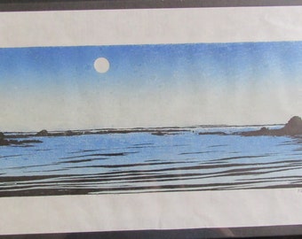May include: A blue and black woodblock print of a seascape with a full moon in the sky. The print is signed "Naomi Drake" in the lower right corner.