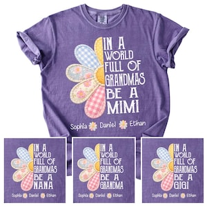 May include: A purple t-shirt with a large flower design and the text "IN A WORLD FULL OF GRANDMAS BE A MIMI". The flower has petals in various patterns and colors. The names "Sophia", "Daniel", and "Ethan" are below the flower.
