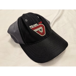 May include: A white ceramic mug with a black handle and the text "But First, Coffee" in a black, handwritten-style font. The mug is on a white surface.