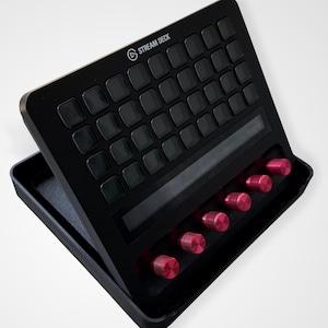 May include: A set of three ceramic mugs with a speckled, matte finish. The mugs are in shades of cream, light gray, and dark gray. Each mug has a simple, minimalist design, perfect for coffee or tea.