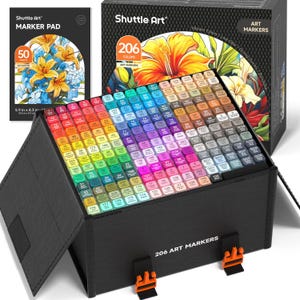 May include: A black box set of 206 art markers with a variety of colors, and a marker pad. The box is open, revealing the markers arranged in rows. The marker pad has a floral design. The box and pad are labeled "Shuttle Art".