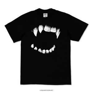 May include: A black short-sleeve t-shirt featuring a large, white, distressed graphic print of a set of sharp vampire fangs in the center. The shirt has a crew neckline and a small white label at the inner collar with the text MYEYE.PROJECT.