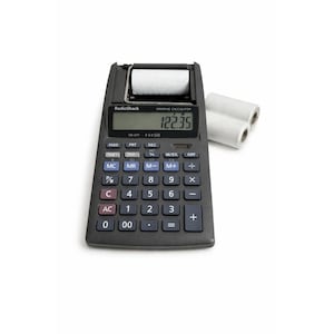 May include: A black RadioShack printing calculator with a paper roll and two spare rolls. The calculator displays "122.35" on the screen. The calculator has various function keys and a numeric keypad.