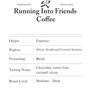 May include: A white ceramic mug with a black handle and the text "But First, Coffee" in a bold, black font. The mug is sitting on a wooden surface. The mug is approximately 4 inches tall.