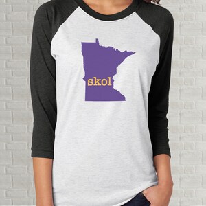 purple and gold raglan shirt