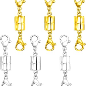 May include: A collection of gold and silver magnetic clasp connectors. Each connector features a lobster claw clasp at each end, connected to a cylindrical magnetic clasp. The gold connectors have gold clasps, and the silver connectors have silver clasps.